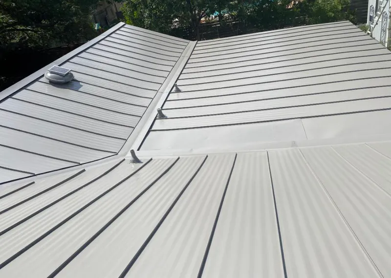 Solar attic fan installed on a metal roof for Roof Ventilation in Redding